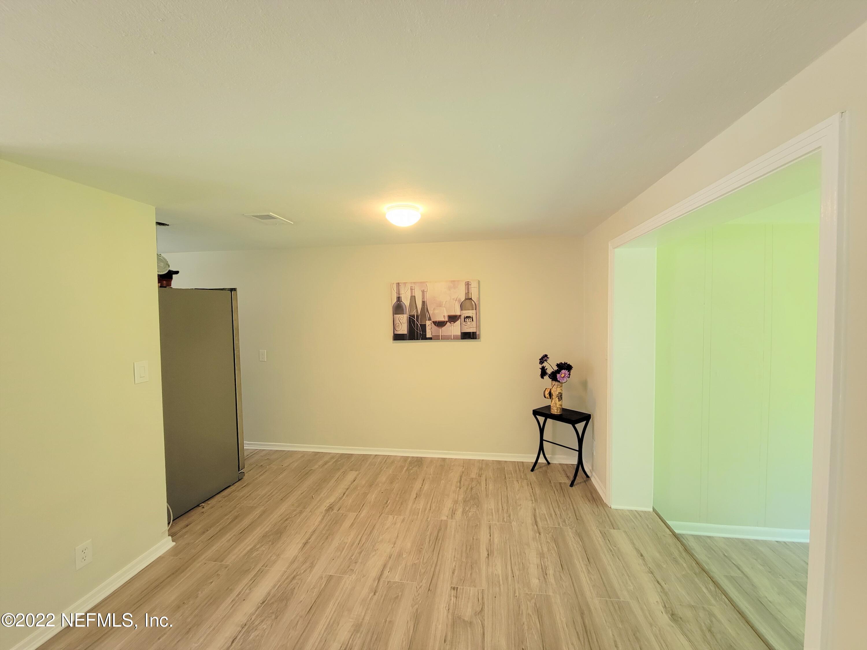 5118 Spring Glen Road Jacksonville, FL 32207 - Photo 11 of 33 a view of a room with wooden floor and a staircase