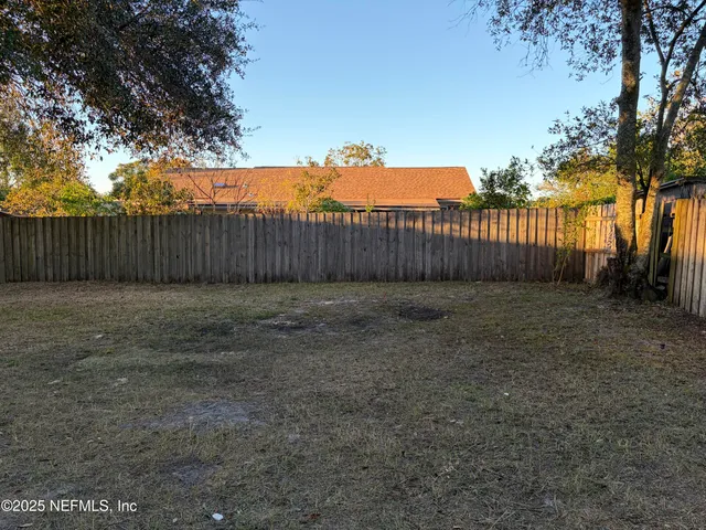 a view of a backyard of a house