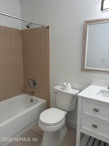 a bathroom with a sink a toilet and a bathtub