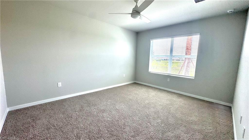 17710 Shade Tree Loop Babcock Ranch, FL 33982 - Photo 12 of 28 an empty room with a window