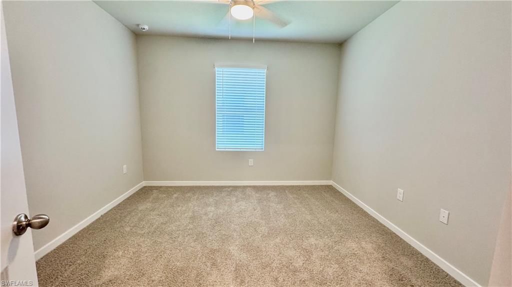 17710 Shade Tree Loop Babcock Ranch, FL 33982 - Photo 18 of 28 an empty room with a window