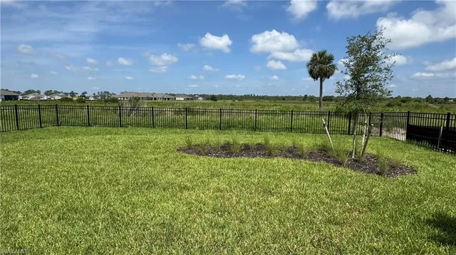 a view of a golf course with a lake