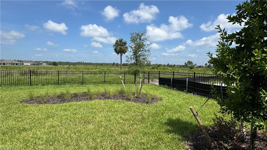 17710 Shade Tree Loop Babcock Ranch, FL 33982 - Photo 25 of 28 a view of a golf course with a garden