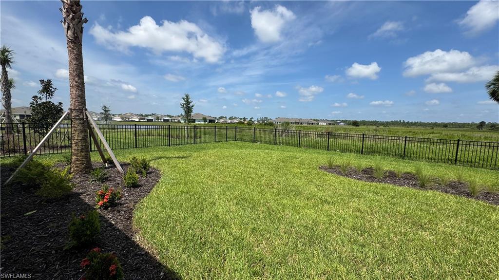 17710 Shade Tree Loop Babcock Ranch, FL 33982 - Photo 26 of 28 a view of a golf course with a lake