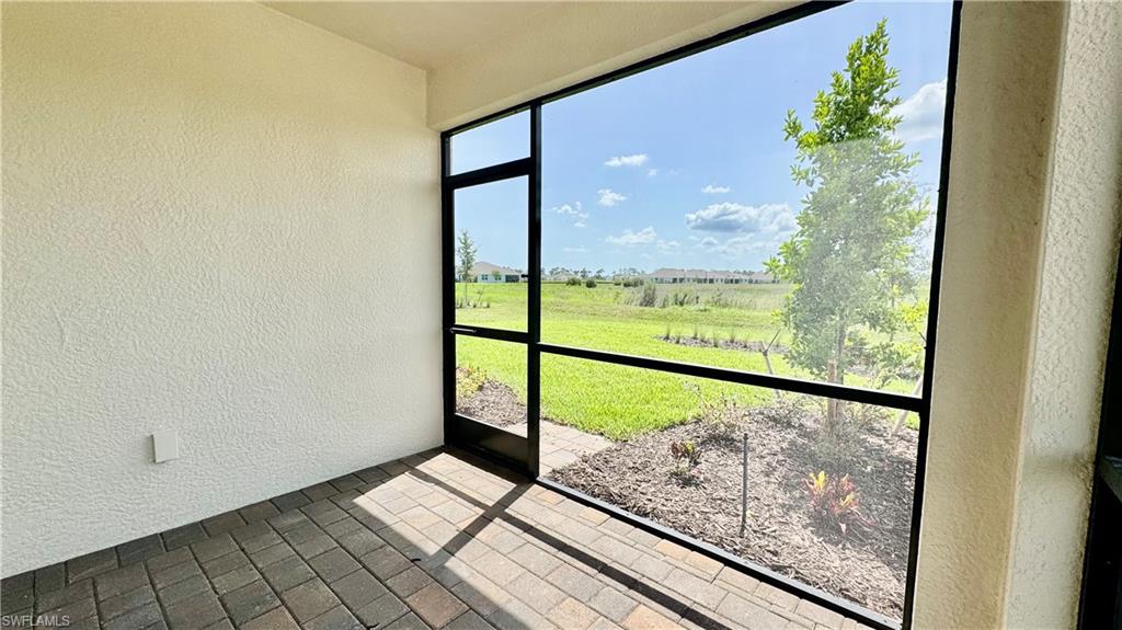 17710 Shade Tree Loop Babcock Ranch, FL 33982 - Photo 9 of 28 a view of a glass door
