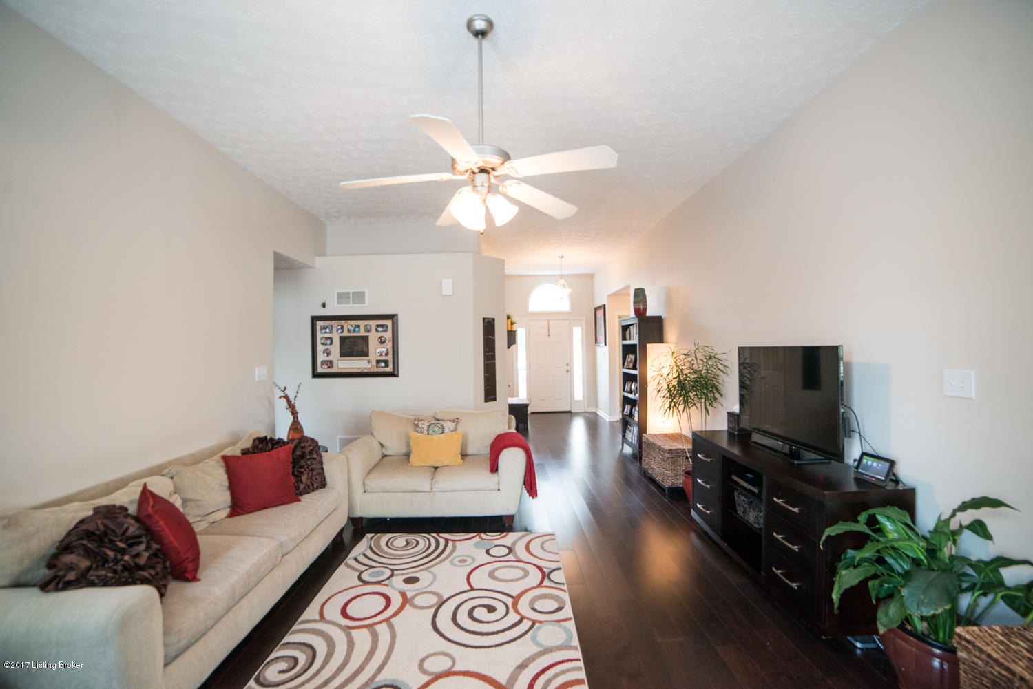 17520 Curry Branch Road Louisville, KY 40245 - Photo 8 of 45 A perfect space for hosting and entertaining, the Living Room features an open concept and gleaming dark hardwood floors that flow throughout the living spaces