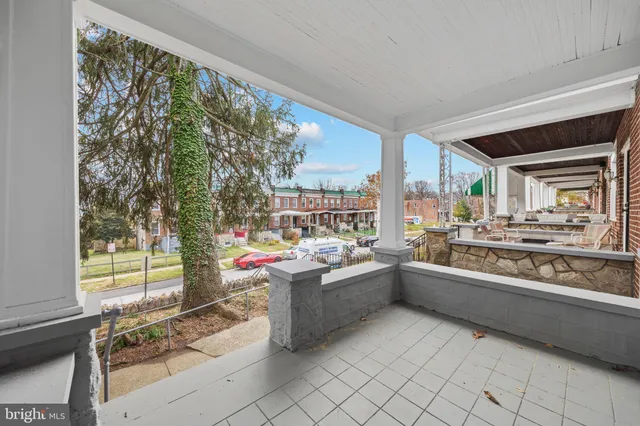 a kitchen view with a stove and white cabinets