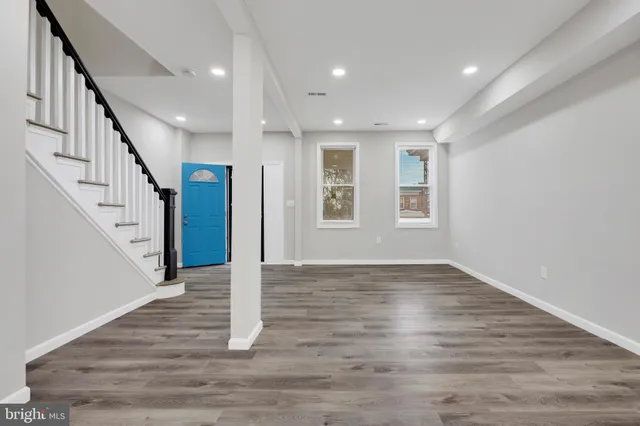 a view of an entryway with wooden floor