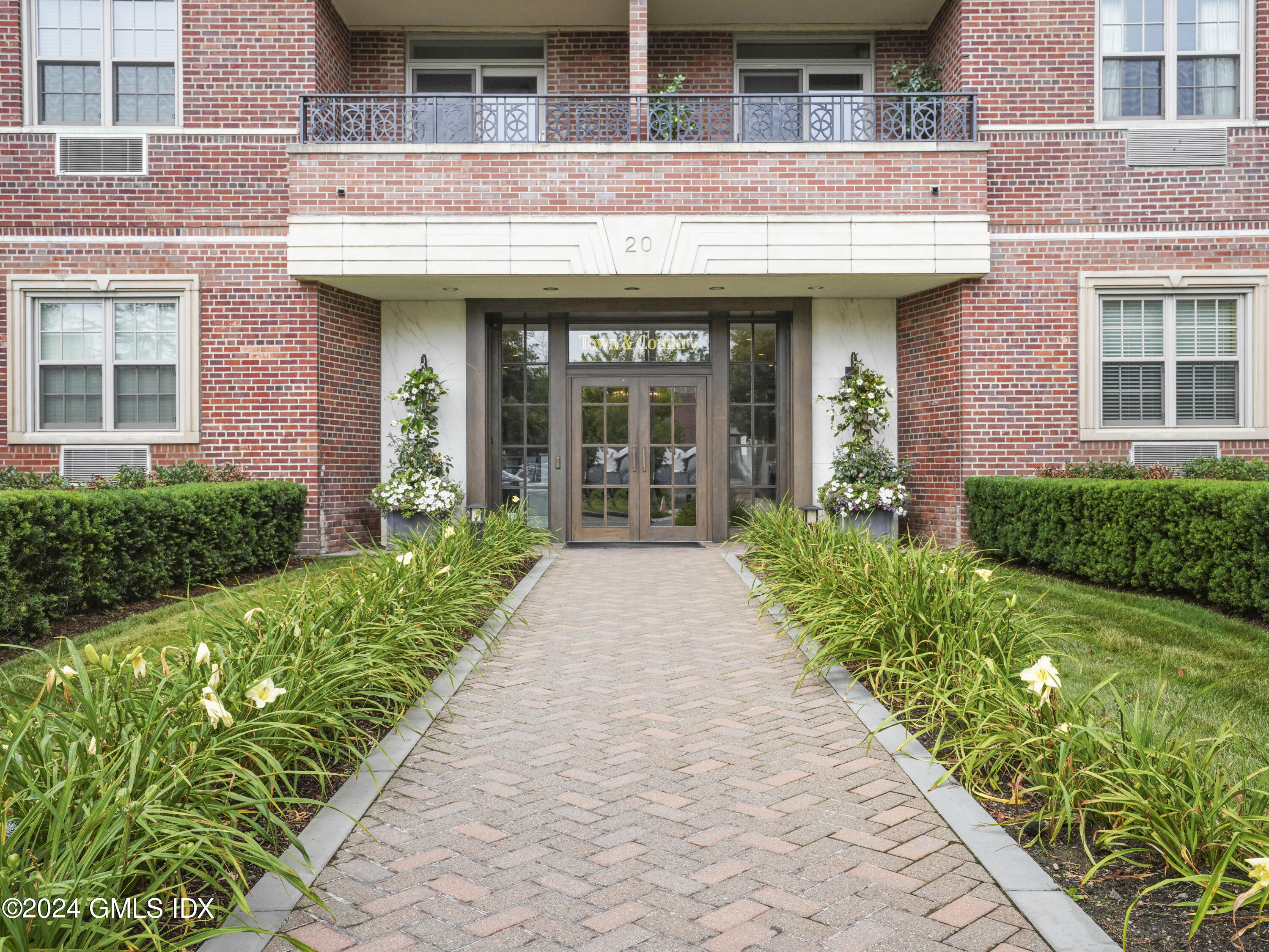 20 Church Street, Unit A26 Greenwich, CT 06830 - Photo 2 of 13 a view of a building with garden