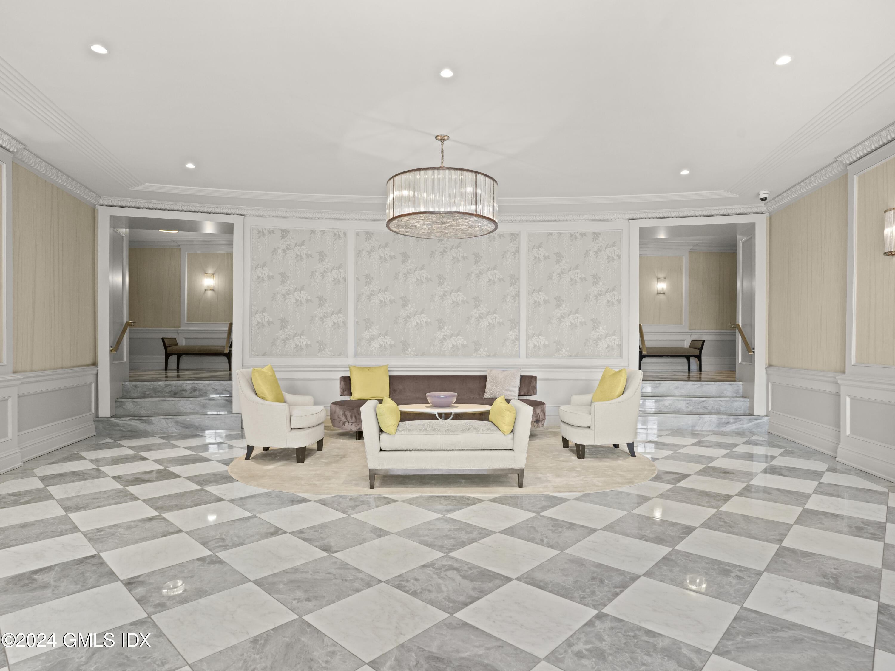 20 Church Street, Unit A26 Greenwich, CT 06830 - Photo 3 of 13 a living room with furniture and a chandelier