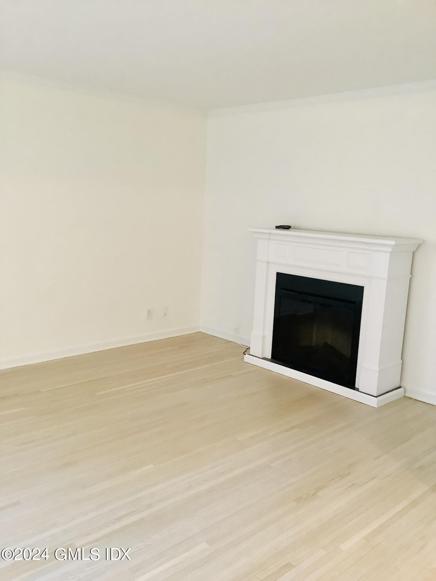 20 Church Street, Unit A26 Greenwich, CT 06830 - Photo 8 of 13 a view of empty room with a fireplace