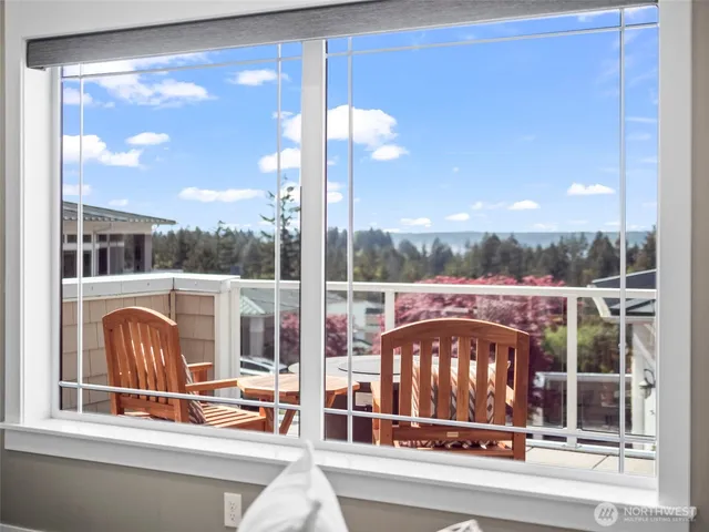 a view of a glass door with a floor to ceiling window