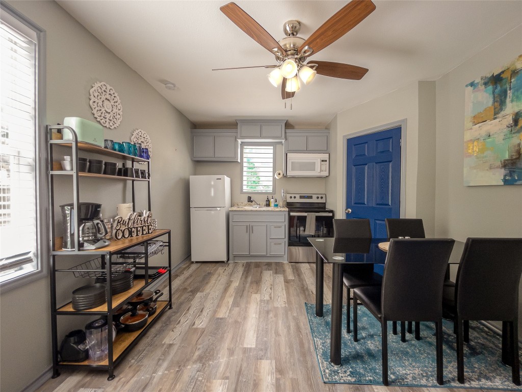 7124 Avenue F, Unit 1 Houston, TX 77011 - Photo 3 of 12 a view of a dining room with furniture and chandelier