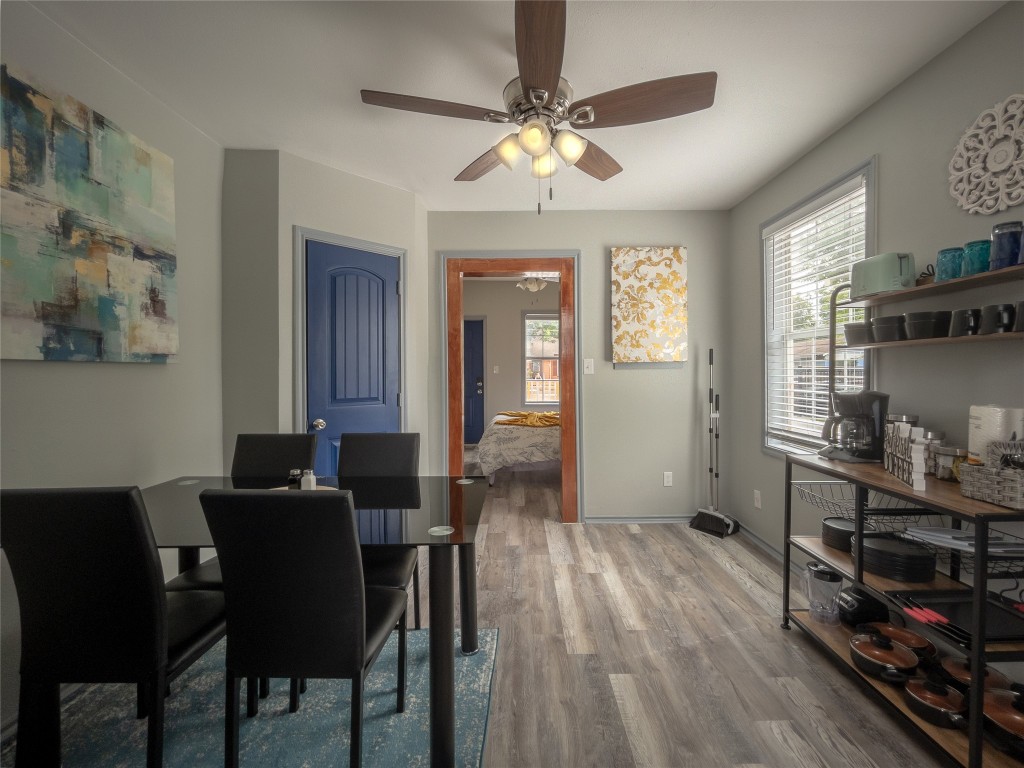 7124 Avenue F, Unit 1 Houston, TX 77011 - Photo 4 of 12 a view of a dining room with furniture and wooden floor