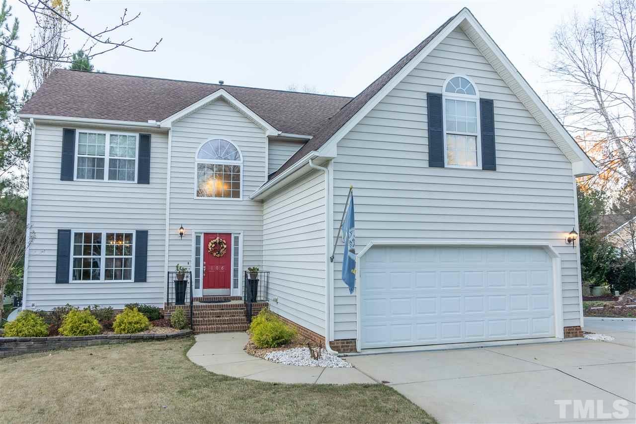 106 Braid Court Raleigh, NC 27603 - Photo 2 of 30 a view of a house with a yard and garage