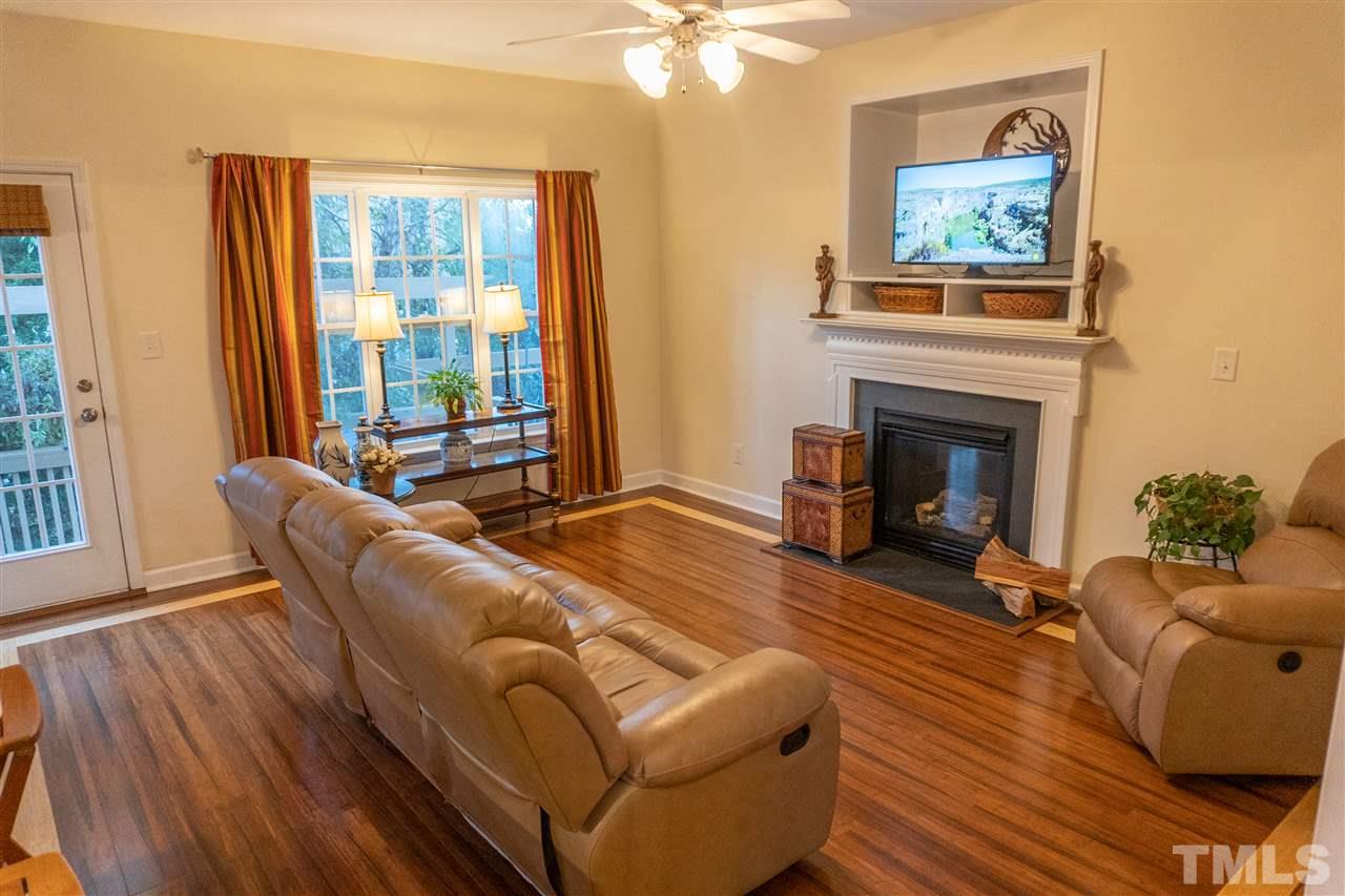 106 Braid Court Raleigh, NC 27603 - Photo 12 of 30 a living room with furniture and a fireplace