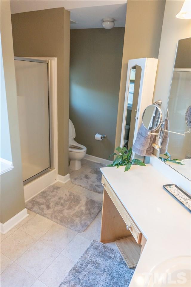 106 Braid Court Raleigh, NC 27603 - Photo 21 of 30 a room with a sink and a mirror