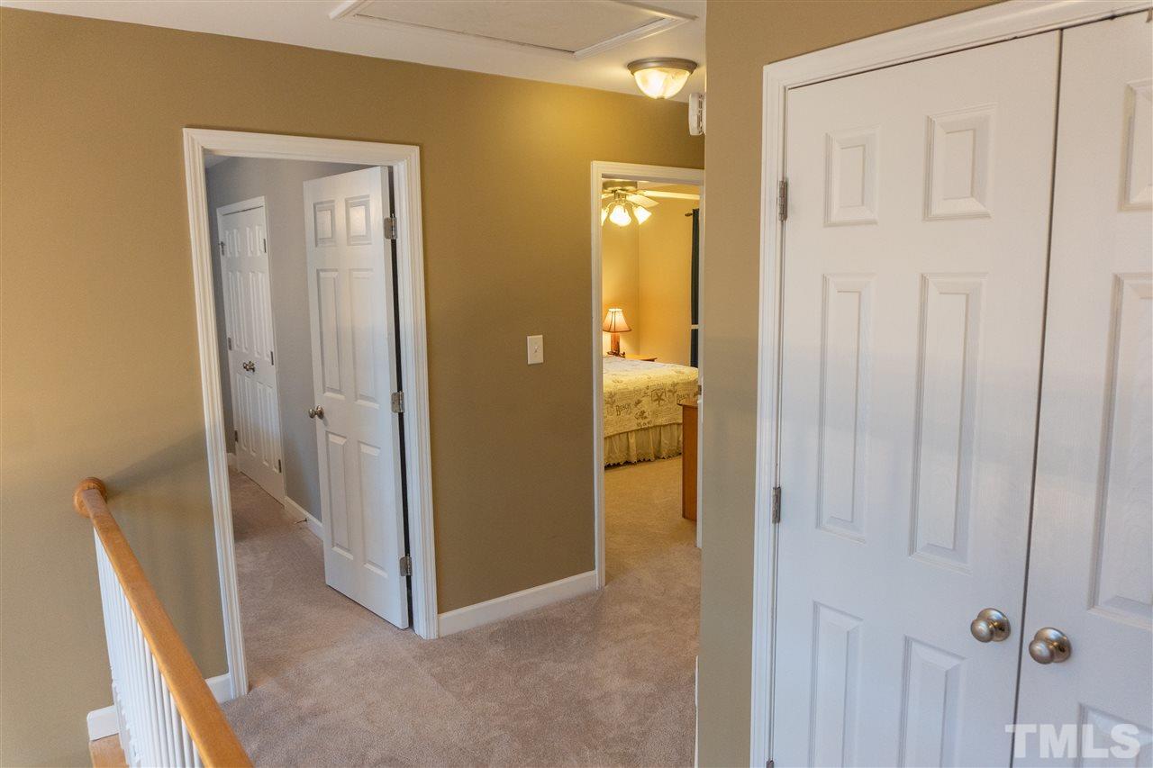 106 Braid Court Raleigh, NC 27603 - Photo 26 of 30 a view of a hallway with closet and bathroom