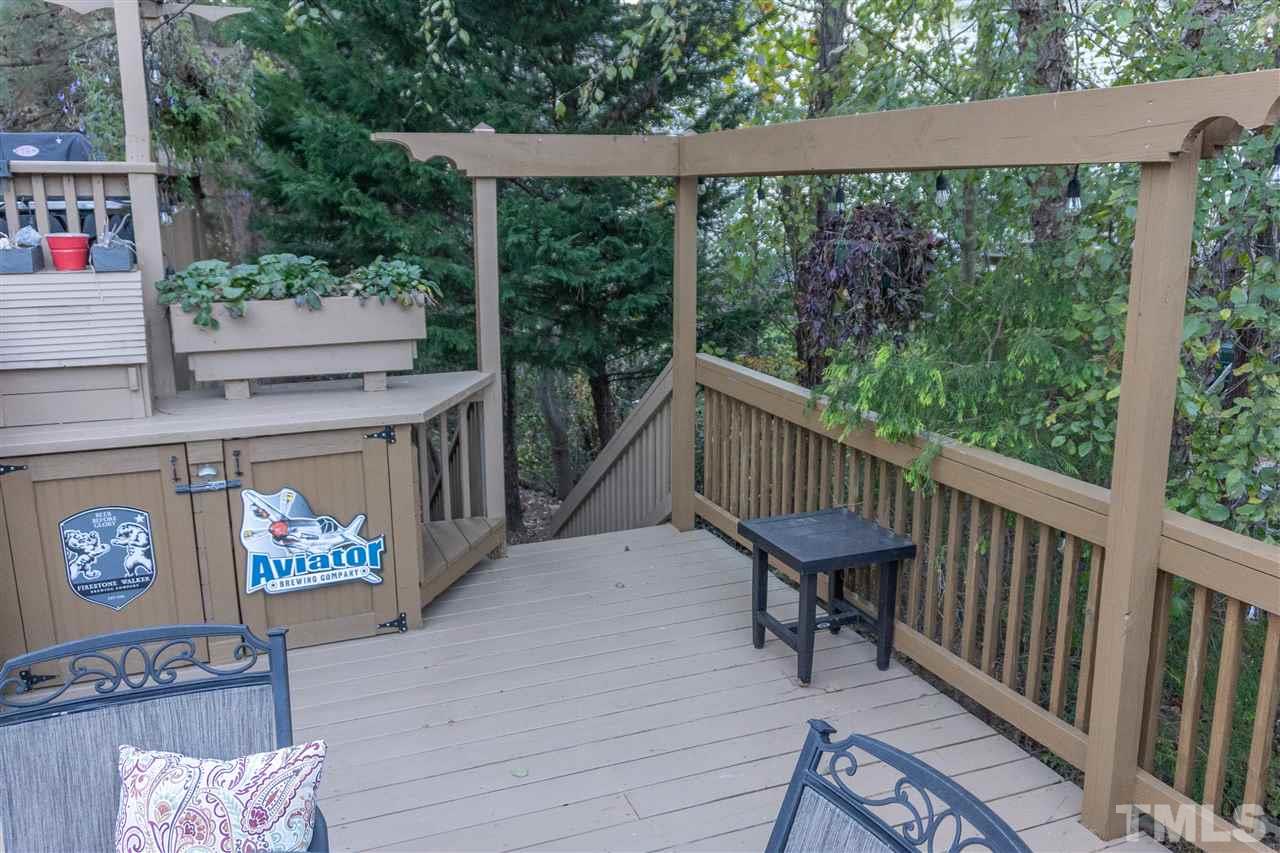 106 Braid Court Raleigh, NC 27603 - Photo 6 of 30 a balcony with trees in front of it