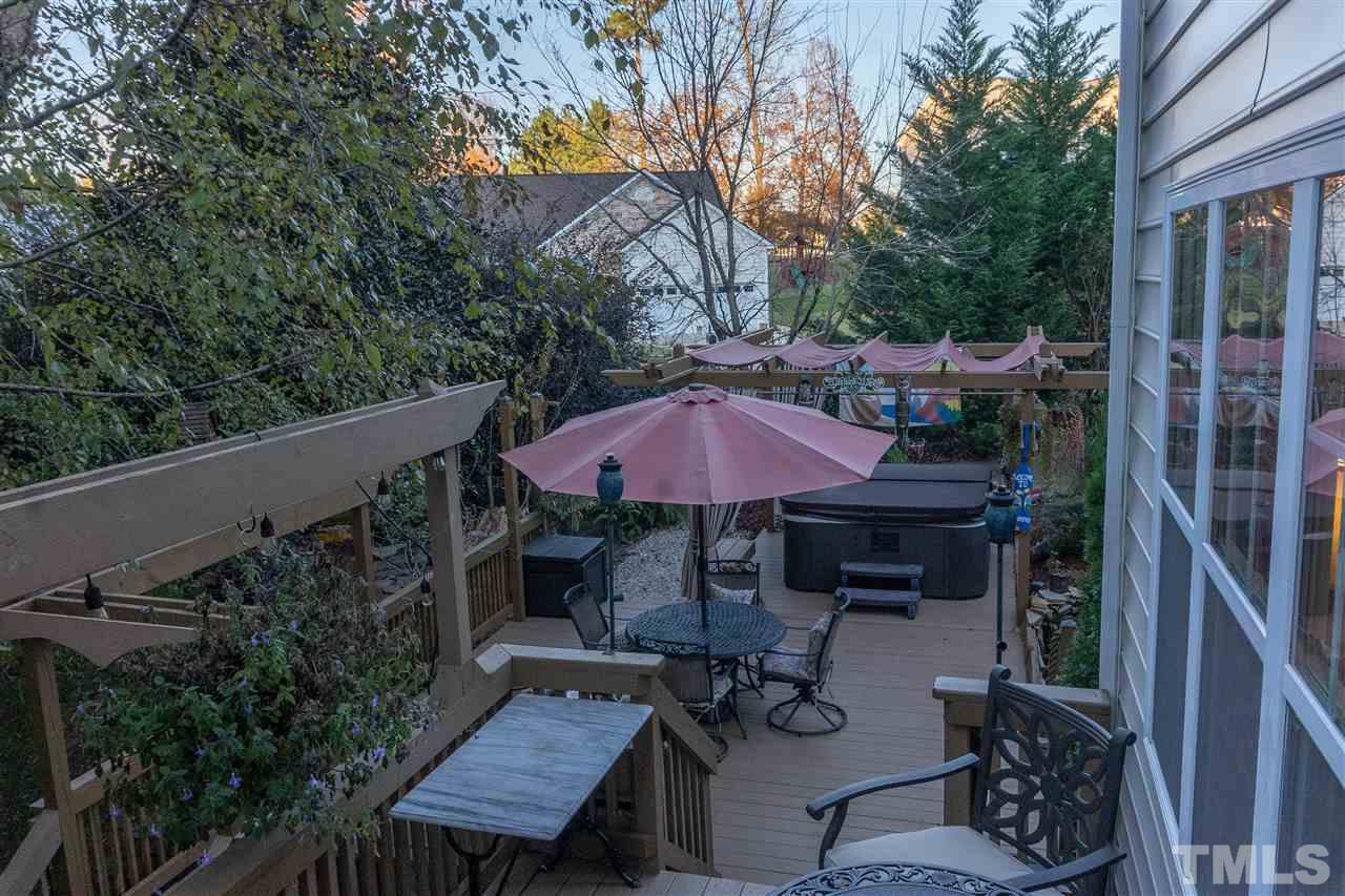 106 Braid Court Raleigh, NC 27603 - Photo 8 of 30 a view of a patio with furniture and a backyard