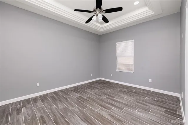 a view of room with window and ceiling fan