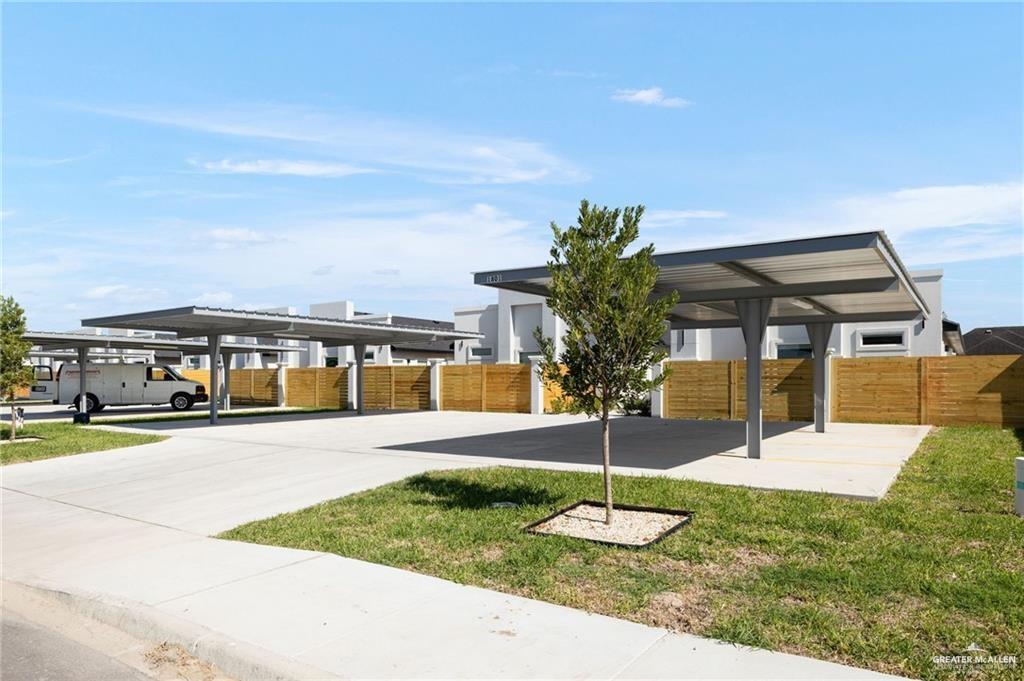 1801 Monaco Drive, Unit 2 San Juan, TX 78589 - Photo 2 of 17 a swimming pool with outdoor seating and yard