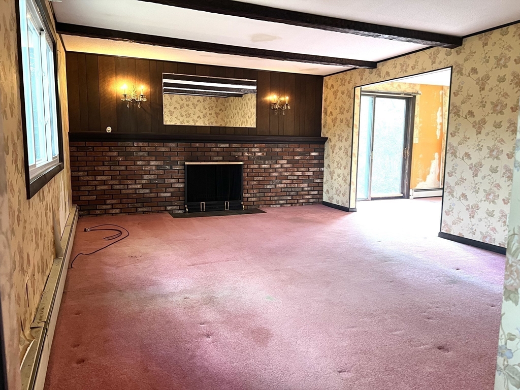 831 Providence Road Northbridge, MA 01588 - Photo 11 of 40 a view of empty room with window and fireplace
