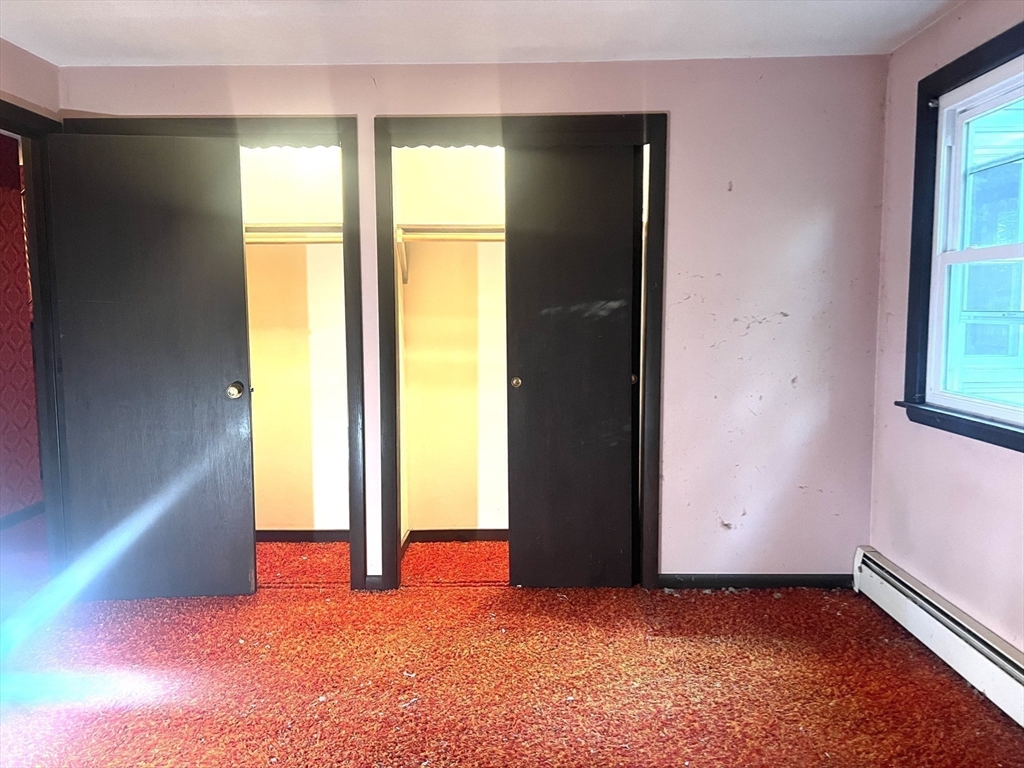 831 Providence Road Northbridge, MA 01588 - Photo 14 of 40 an empty room with windows and closet