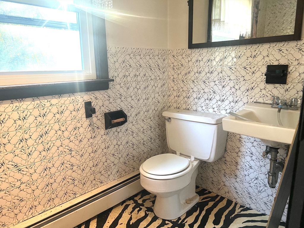831 Providence Road Northbridge, MA 01588 - Photo 23 of 40 a bathroom with a toilet and a sink