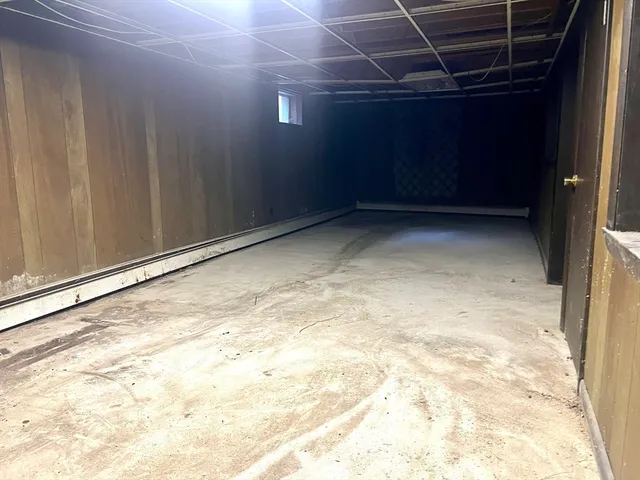 a view of a room with wooden walls