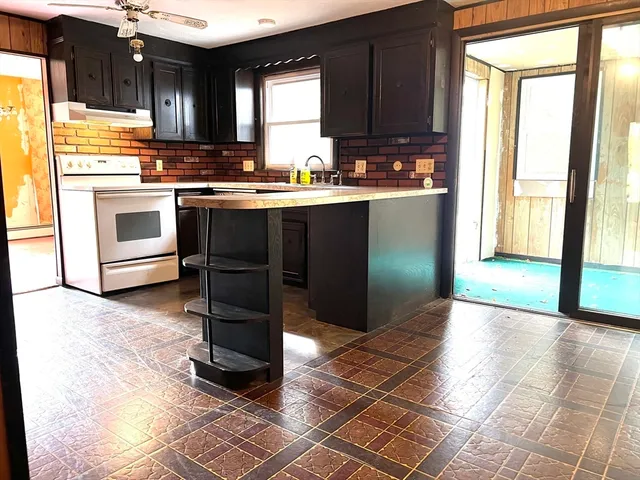 a view of a room with a large window