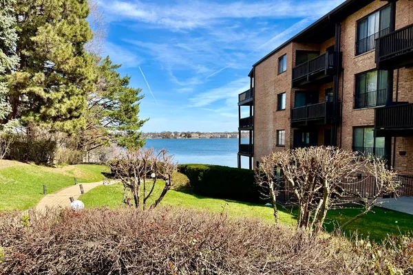 a view of a lake with a house in background