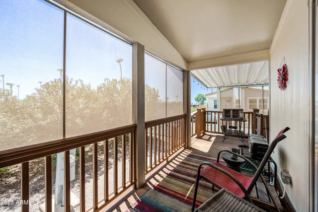 a view of a balcony with chairs