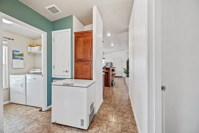a work room with furniture wooden floor and a window