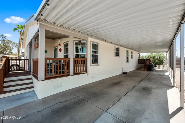 a view of a porch with wooden stairs and stairs