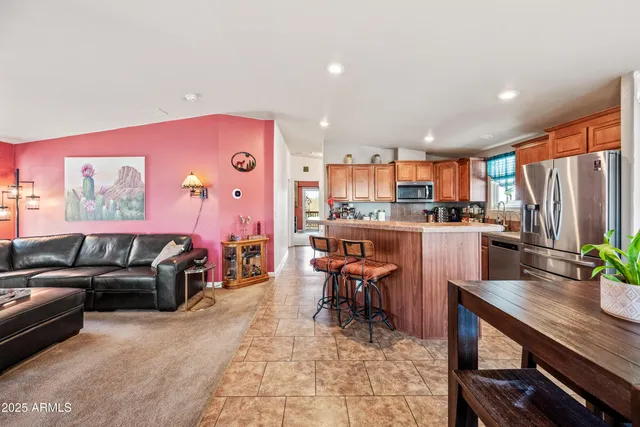 a living room with furniture and a table
