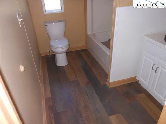 a bathroom with a toilet and a sink