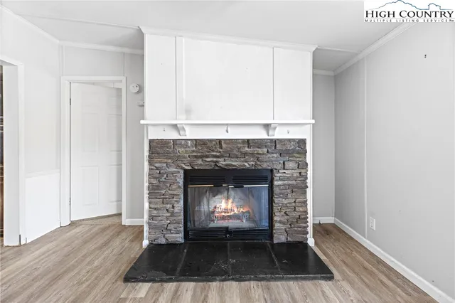 a living room with a fireplace and a floor