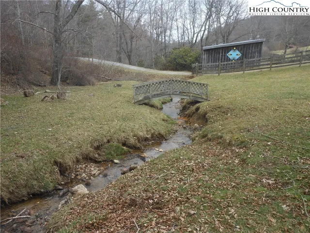 a view of a swimming pool with a yard