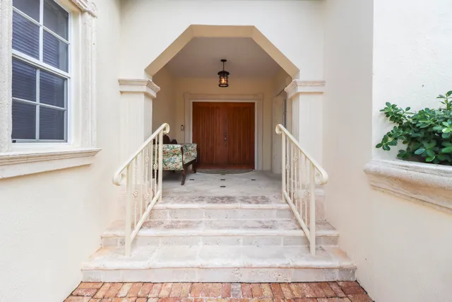 a living room with furniture a large window and flat screen tv