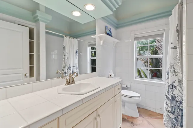 a bedroom with bed and window