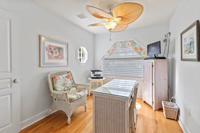 a spacious bedroom with a bed and large window