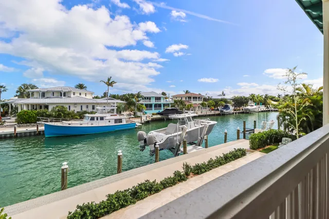 a view of a house with a backyard patio and entertaining space