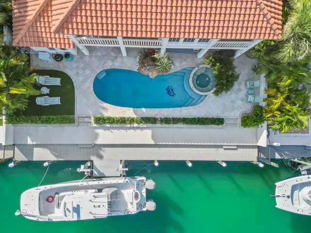 a view of a two chairs in the patio