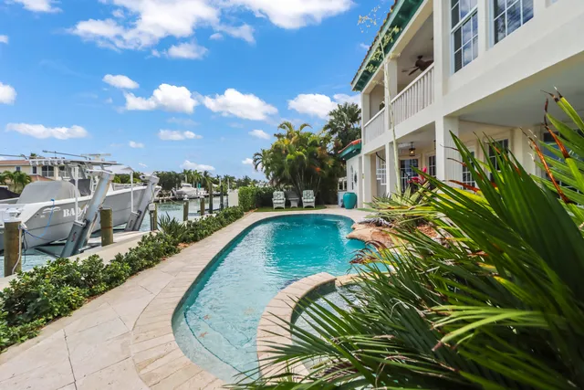 a view of a swimming pool with lounge chair