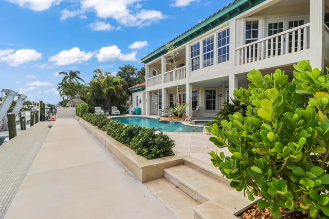 a view of an outside dining space with furniture