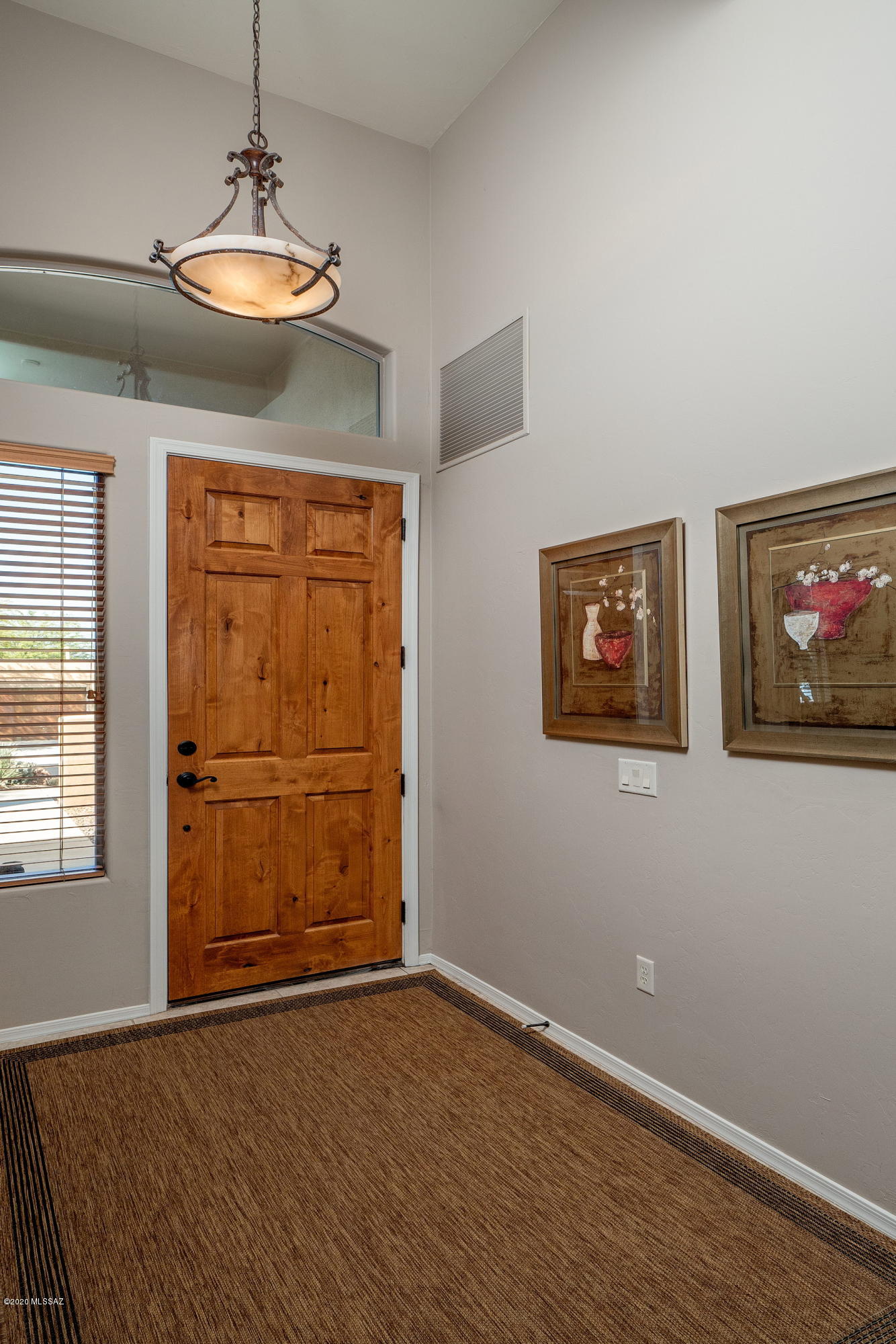 4440 West Crystal Ranch Place Marana, AZ 85658 - Photo 15 of 28 an empty room with windows and cabinet