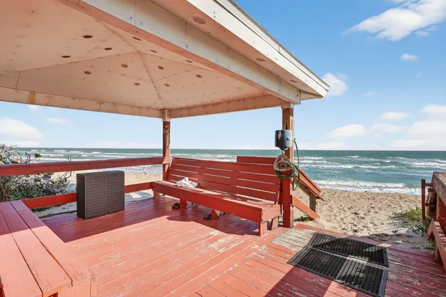 a view of a yard with an ocean