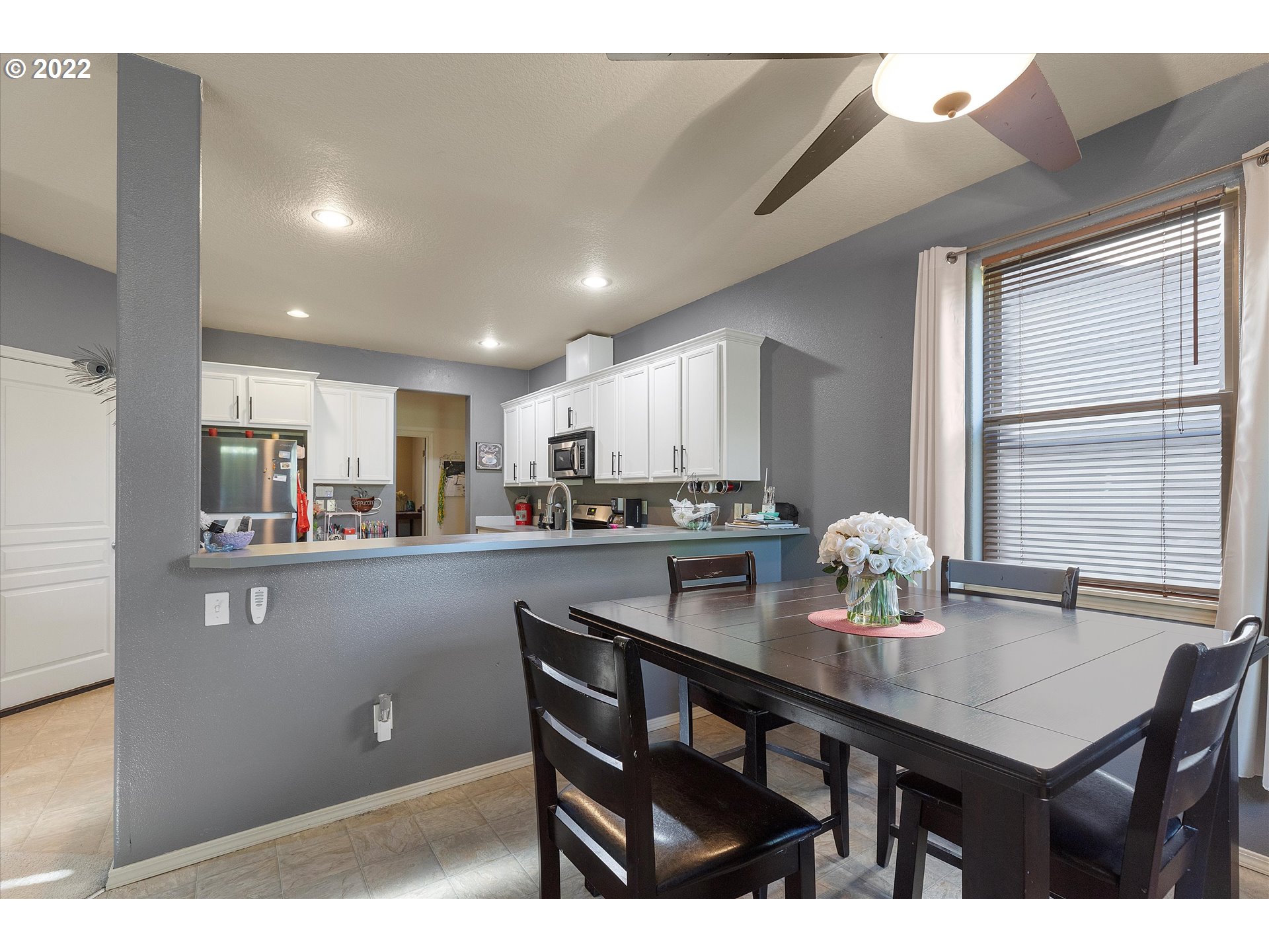 40310 Dubarko Road Sandy, OR 97055 - Photo 11 of 23 a kitchen with kitchen island cabinets and wooden floor