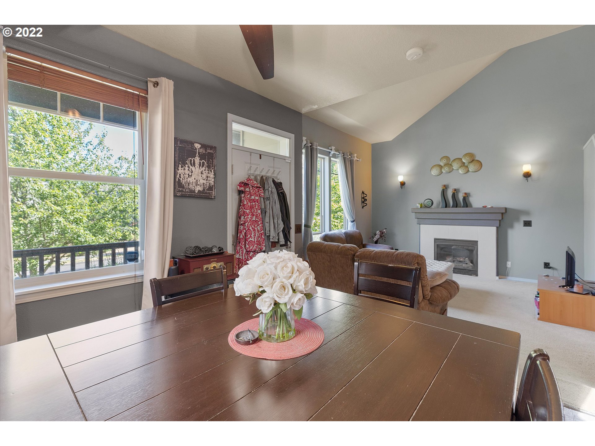 40310 Dubarko Road Sandy, OR 97055 - Photo 7 of 23 a living room with furniture a fireplace and a large window